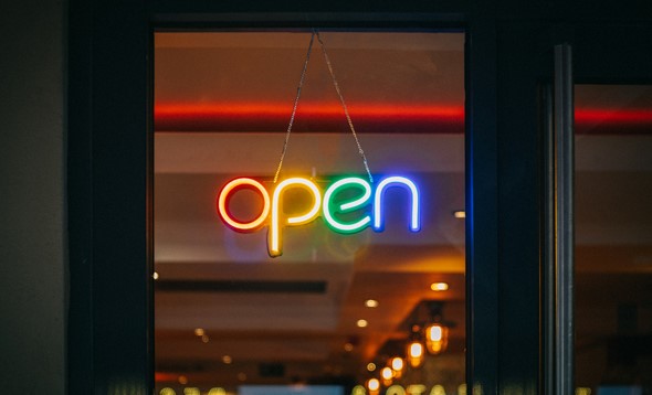 Colourful neon 'Open' sign in a shop window