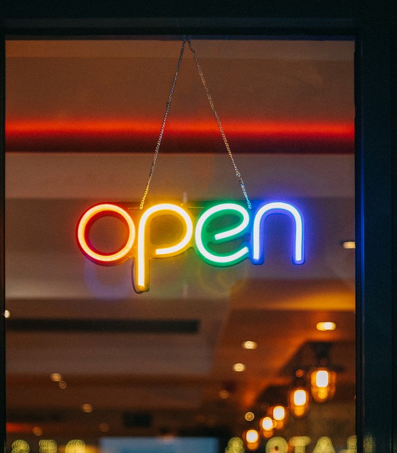 Colourful neon 'Open' sign in a shop window