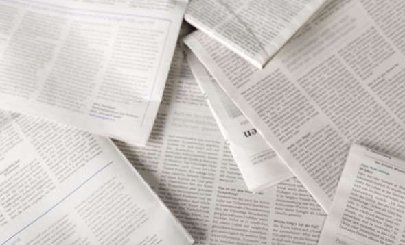 Overhead shot of blurred pile of academic articles