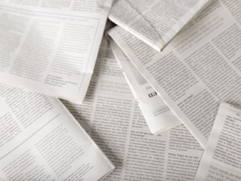 Overhead shot of blurred pile of academic articles