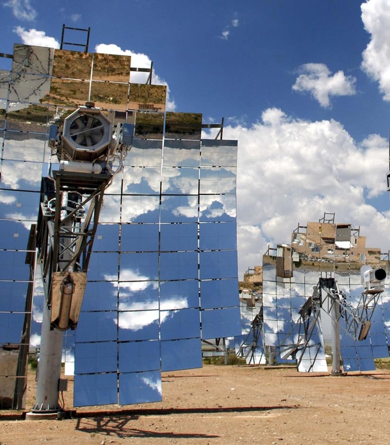 Solar panel installations in the desert under a blue sky