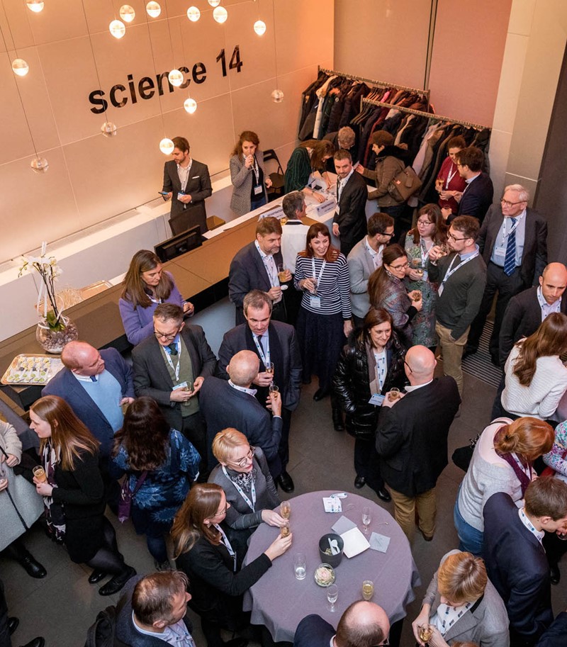 Overhead shot of Science Europe event networking session on their premises